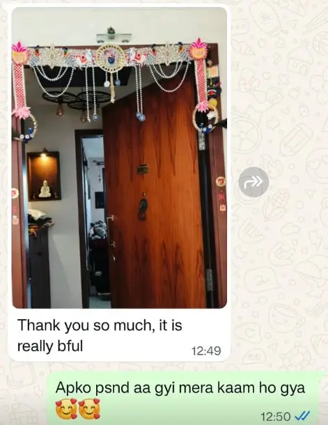 Customer photo of a pearl toran on their door, with the message: Thank you so much, it is really beautiful